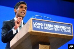 FILE - Britain's Prime Minister Rishi Sunak speaks during the Conservative Party annual conference in Manchester, England, Oct. 4, 2023. Sunak has vowed to “stop the boats” as a top priority to curb unauthorized immigration.