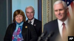 Vice President Mike Pence takes the podium to speak at a swearing in ceremony for Health and Human Services Secretary Tom Price, accompanied by his wife Betty, Feb. 10, 2017, in the in the Eisenhower Executive Office Building in Washington.