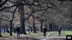 Residents exercise at Hagley Park in Christchurch, New Zealand, Aug. 9, 2020. 