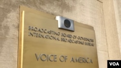 FILE - Signage is seen at the entrance to Voice of America headquarters in Washington. (Mia Bush/VOA)