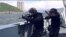 This screengrab taken from undated handout three-minute promotional video received on Aug. 1, 2019, from China's People's Liberation Army (PLA) Hong Kong Garrison shows armed PLA soldiers on a boat during a drill in Hong Kong waters. 