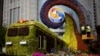 Workers on a platform install flowers on a display in a shape of a train to promoting the upcoming Belt and Road Forum (BRF) in Beijing, China, April 23, 2019.
