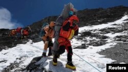 Nepali sherpa hauls Malaysian climber in rare Everest 'death zone' rescue