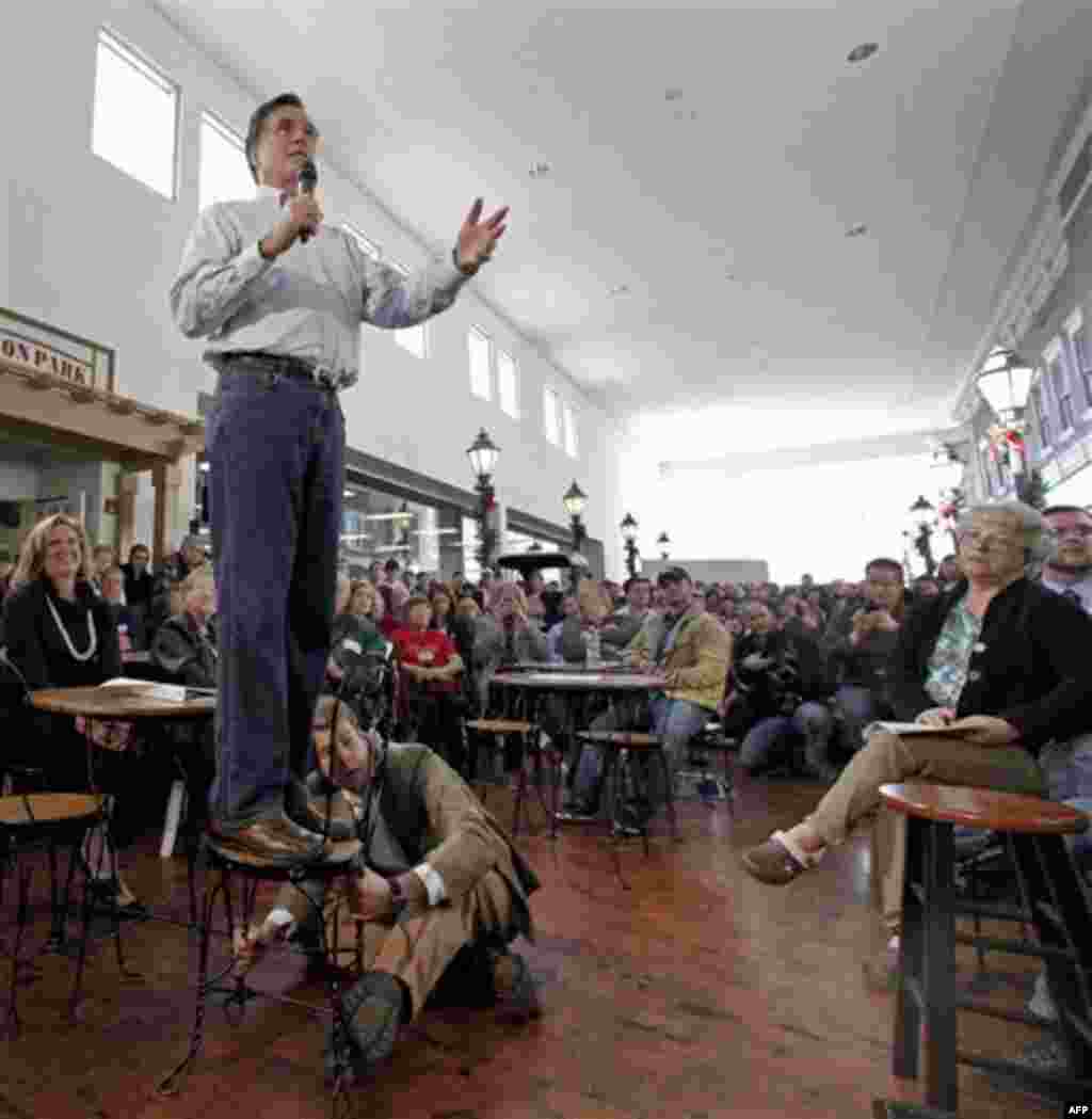 Republican presidential candidate, former Massachusetts Gov. Mitt Romney speaks during a campaign stop at the Music Man Square in Mason City, Iowa Thursday, Dec. 29, 2011. (AP Photo/Charlie Riedel)