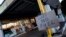 A sign showing customers that fuel has run out is pictured at the Hilltop Garage petrol station, in Rothley, Leicestershire, Britain, Sept. 25, 2021.