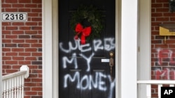 Graffiti reading, "Where's my money" is seen on a door of the home of Senate Majority Leader Mitch McConnell, R-Ky., in Louisville, Ky., on Saturday, Jan. 2, 2021. As of Saturday morning, messages like “where’s my money” and other expletives were…
