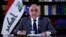 FILE - A still image taken from a video shows then-Iraqi Prime Minister Adel Abdul-Mahdi delivering a speech on reforms ahead of planned protest, in Baghdad, Oct. 25, 2019. 