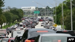 Traffic is backed up after police blocked a road in West Palm Beach, Florida, Sept. 15, 2024, following a shooting incident at the former president's Trump International Golf Club.