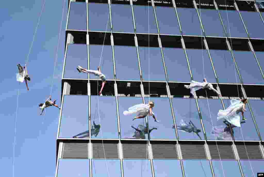 Members of &quot;BANDALOOP&quot; perform at the opening of &quot;Edge,&quot; the Western Hemisphere&#39;s highest outdoor sky deck, rising 1,131 feet in the air from the heart of Hudson Yards, located on the 100th floor in New York City. 