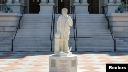 A statue of Italian explorer Christopher Columbus stands outside the Eisenhower Executive Office Building near the White House in Washington, D.C., U.S., March 23, 2026. REUTERS/Kylie Cooper