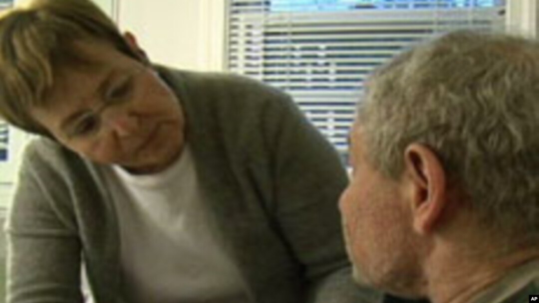 FILE - Steven Mintz, diagnosed with multiple sclerosis more than 20 years ago, increasingly depends on his wife, Suzanne, for his daily needs. 