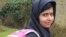 FILE - Malala Yousufzai smiles as she attends school in Edgbaston, central England, in this handout photograph released March 19, 2013.