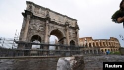 Fragments of the Arch of Constantine lie on the ground after lightning struck it during a storm in Rome, Sept. 3, 2024.