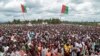 Crowds of supporters of the ruling party gather for the start of the election campaign, in Bugendana, Burundi. Burundi is expelling WHO's top official in the country Walter Kazadi Mulombo and three experts, saying they must leave by Friday, May 15, 2020.
