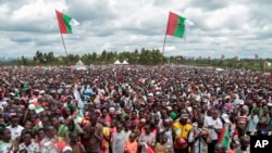 Crowds of supporters of the ruling party gather for the start of the election campaign, in Bugendana, Burundi. Burundi is expelling WHO's top official in the country Walter Kazadi Mulombo and three experts, saying they must leave by Friday, May 15, 2020.