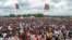 Crowds of supporters of the ruling party gather for the start of the election campaign, in Bugendana, Burundi. Burundi is expelling WHO's top official in the country Walter Kazadi Mulombo and three experts, saying they must leave by Friday, May 15, 2020.