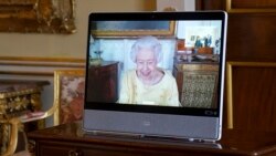 Queen Elizabeth II appears on a screen via videolink from Windsor Castle, where she is in residence, during a virtual audience at Buckingham Palace, London, Oct. 26, 2021. 