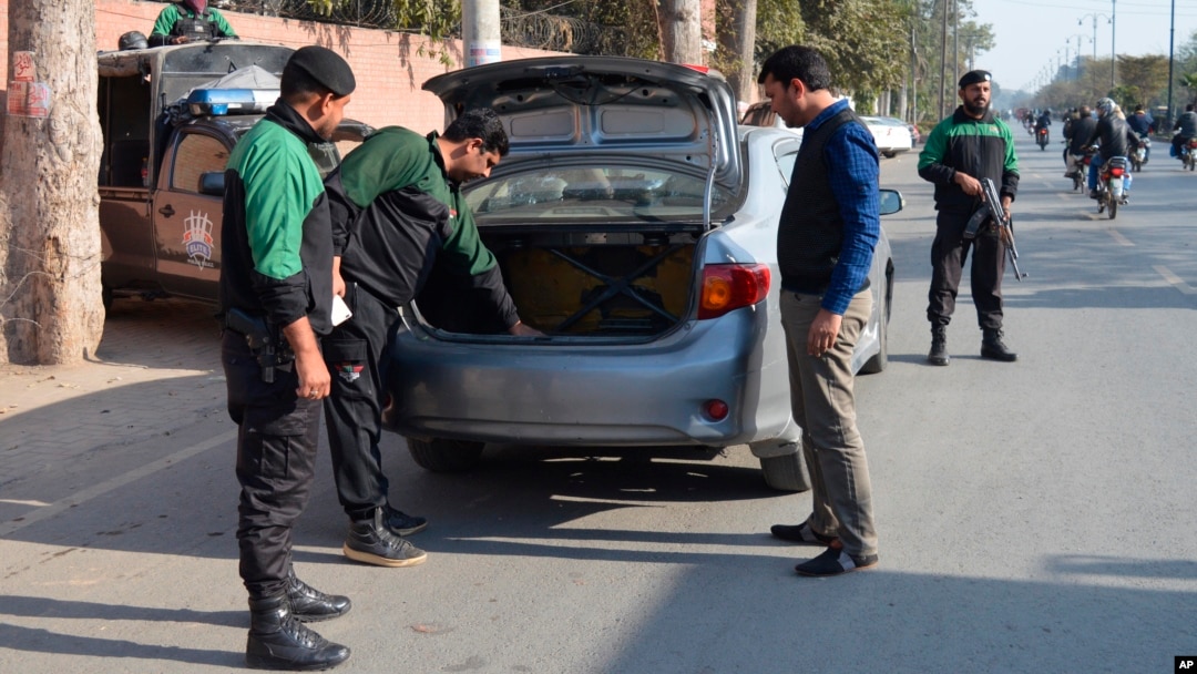 FILE - Police officers check a vehicle in Faisalabad, Jan. 15, 2019. Pakistan counterterrorism police have arrested an al-Qaida leader and close aide to Osama bin Laden after a yearslong manhunt, officials said July 19, 2024.