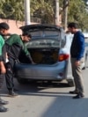 FILE - Police officers check a vehicle in Faisalabad, Jan. 15, 2019. Pakistan counterterrorism police have arrested an al-Qaida leader and close aide to Osama bin Laden after a yearslong manhunt, officials said July 19, 2024.