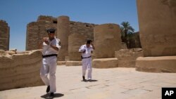 Egyptian policemen patrol the ruins of the Karnak Temple in Luxor, Egypt, June 11, 2015.