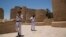 Egyptian policemen patrol the ruins of the Karnak Temple in Luxor, Egypt, June 11, 2015.