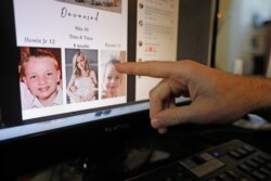 Austin Cloes points to a photo of relatives Rhonita Miller and her family, who were killed in Mexico, on a computer screen, Nov. 5, 2019, in Herriman, Utah.
