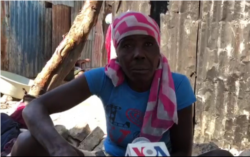 This street merchant, shown in Port-au-Prince, Haiti, on April 3, 2020, believes eating limes and drinking water infused with Clorox will keep her healthy.