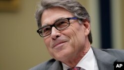 FILE - Energy Secretary Rick Perry listens during a hearing about the electrical grid, on Capitol Hill in Washington, Oct. 12, 2017. The Federal Energy Regulatory Commission on Jan. 8, 2018, rejected a Trump administration plan to bolster coal-fired and nuclear power plants.