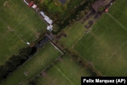 New soccer fields can be seen where floating gardens once grew in the Xochimilco borough of Mexico City, on Sunday, October 20, 2024. (AP Photo/Felix Marquez)