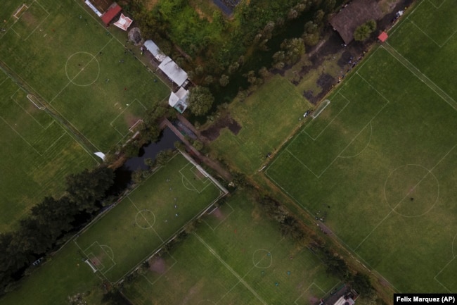 New soccer fields can be seen where floating gardens once grew in the Xochimilco borough of Mexico City, on Sunday, October 20, 2024. (AP Photo/Felix Marquez)