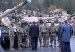 FILE - U.S. Secretary of State Mike Pompeo talks to U.S. soldiers based in Grafenwoehr, Germany, Nov. 7, 2019.