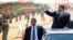 In this image released by the Egyptian Presidency, Egyptian President Mohammed Morsi, waves toward soldiers at a military base in Ismailia, Egypt, Oct. 10, 2012.