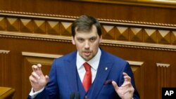 Ukraine's newly elected Prime Minister Oleksiy Honcharuk speaks during a parliament session in Kyiv, Ukraine, Aug. 29, 2019.Honcharuk speaks during parliament session in Kyiv, Ukraine, Aug. 29, 2019.