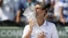 Novak Djokovic, of Serbia, kisses the trophy after defeating Andy Murray, of Britain, during the men's singles final of the Sony Ericsson tennis tournament, Sunday, April 1, 2012, in Key Biscayne, Fla. Djokovic won 6-1, 7-6 (4). (AP Photo/Lynne Sladky)