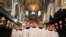 Choristers sing during a rehearsal for their upcoming Christmas performances, at St Paul's Cathedral in central London.