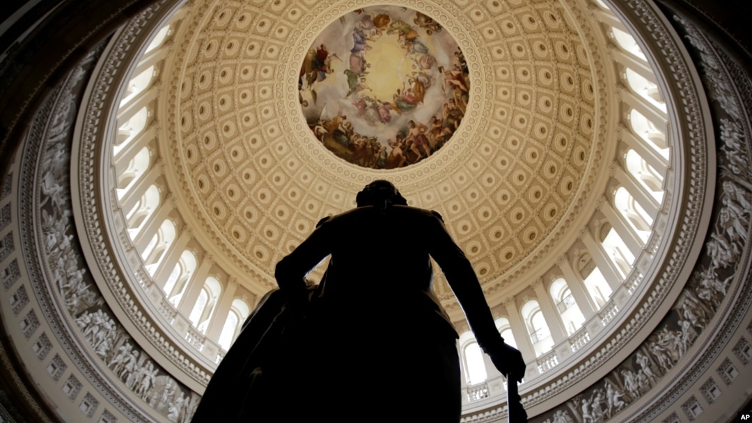 FILE - A statue of George Washington stands in U.S. Capitol Rotunda in Washington.