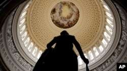 FILE - A statue of George Washington stands in U.S. Capitol Rotunda in Washington.