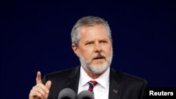 FILE - Liberty University President Jerry Falwell Jr. speaks during the school's commencement ceremonies in Lynchburg, Virginia, May 11, 2019. 