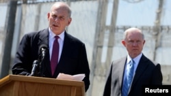 Secretary of Homeland Security John Kelly speaks as Attorney General Jeff Sessions listens as they brief the media during visit to the U.S. Mexico border fence in San Diego, California, U.S. April 21, 2017.