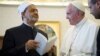 FILE - Pope Francis exchanges gifts with Sheikh Ahmed Mohamed el-Tayeb, left, Egyptian Imam of al-Azhar Mosque at the Vatican, May 23, 2016.