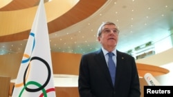 FILE - Thomas Bach, President of the International Olympic Committee (IOC), speaks in Lausanne, Switzerland, March 25, 2020.