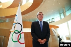 FILE - Thomas Bach, President of the International Olympic Committee (IOC), speaks in Lausanne, Switzerland, March 25, 2020.