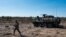 FILE - A U.S. Army soldier and Stryker armored vehicle take part in the "Arrow 16" exercise with the Finnish Army in Niinisalo, Finland, May 4, 2016. U.S. troops are using the Stryker vehicle while offering support near Manbij, Syria, March 6, 2017. 