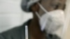 FILE - A medical staff member prepares a syringe at a hospital in Johannesburg, June 24, 2020. International crime fighting agencies are warning of the possibility of fake vaccines entering the market, especially in Africa.