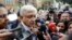 FILE - Mexican President-elect Andres Manuel Lopez Obrador talks to journalist as he arrives to a meeting with his new cabinet in Mexico City, Mexico, July 7, 2018.