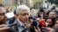 FILE - While still Mexico's president-elect, Andres Manuel Lopez Obrador talks to journalists in Mexico City, Mexico, July 7, 2018. A group of Mexican journalists, columnists and commentators have since demanded that Lopez Obrador, now president, stop harassing critical media.