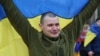 A Ukrainian prisoner of war (POWs) reacts after a swap, amid Russia's attack on Ukraine, at an unknown location in Ukraine, in this handout picture released April 11, 2026. 
