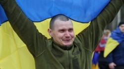 A Ukrainian prisoner of war (POWs) reacts after a swap, amid Russia's attack on Ukraine, at an unknown location in Ukraine, in this handout picture released April 11, 2026. 