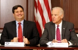 FILE - Then-US Vice President Joe Biden is joined by Ebola Response Coordinator Ron Klain in the Eisenhower Executive Office Building on the White House complex in Washington, Nov. 13, 2014.