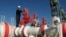 FILE - A worker checks valves on the Yapracik gas pipeline on the outskirts of Ankara, Turkey, Jan. 9, 2009.